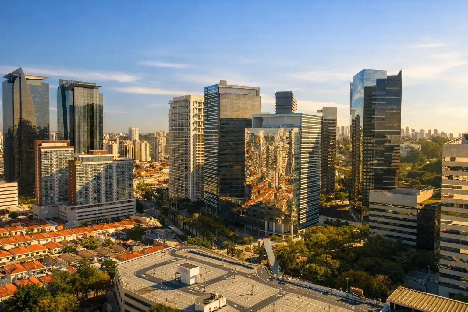 Modern office towers in Brooklin with mirrored glass facades reflecting surrounding buildings under a clear sky