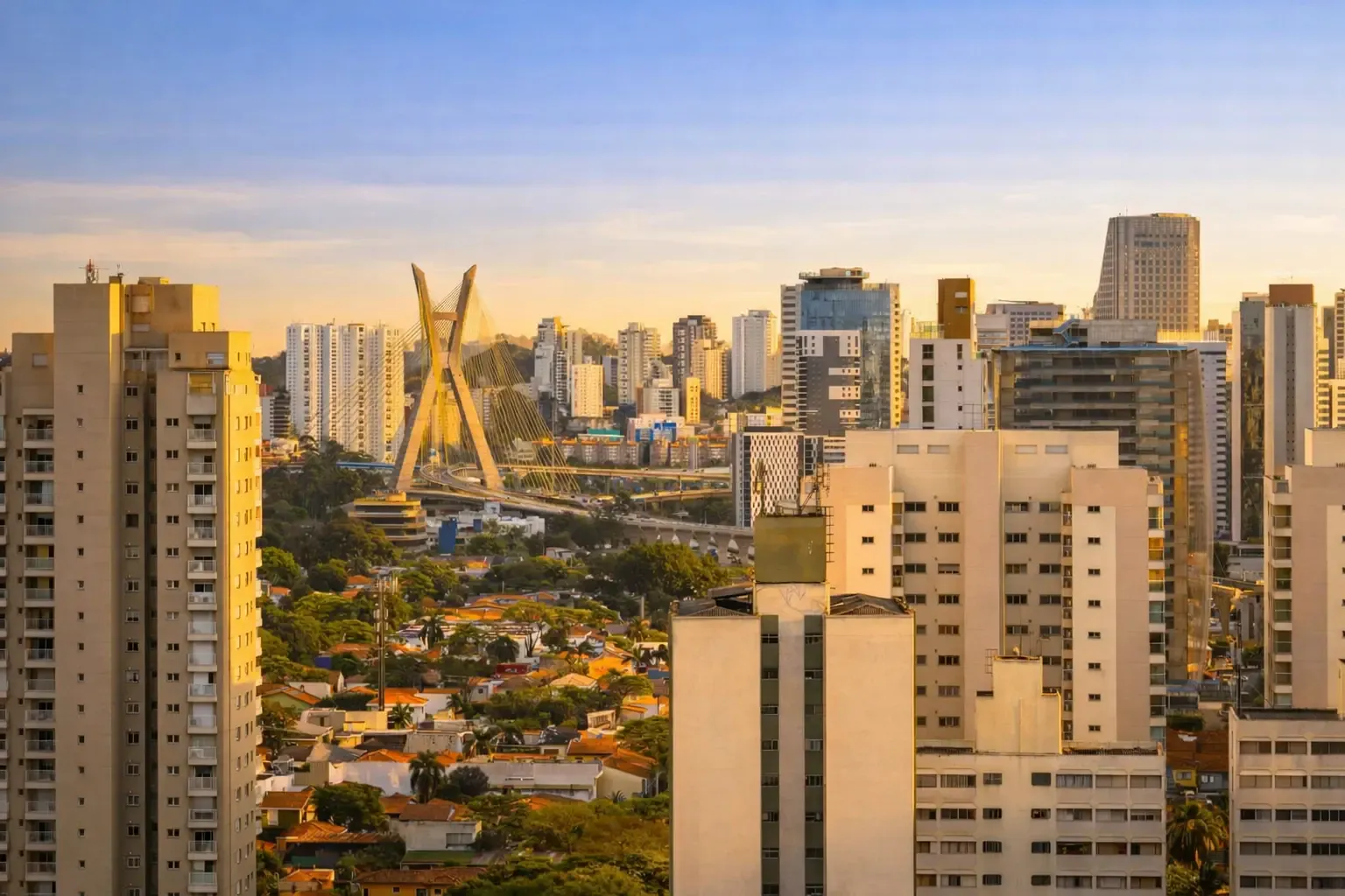 Cityscape view of Brooklin at golden hour with the cable-stayed bridge centered among high-rise buildings
