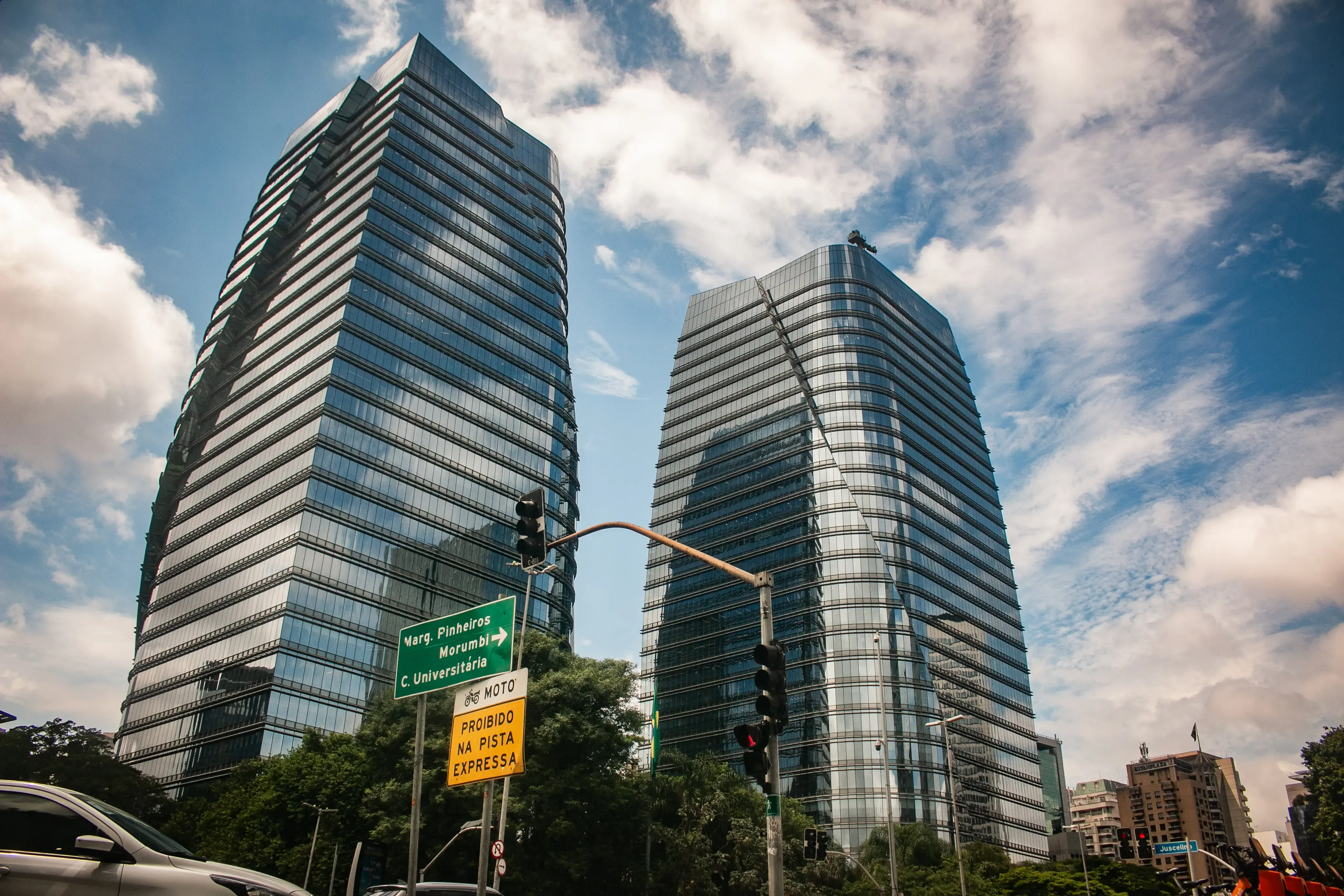 Modern glass towers rising above a commercial building