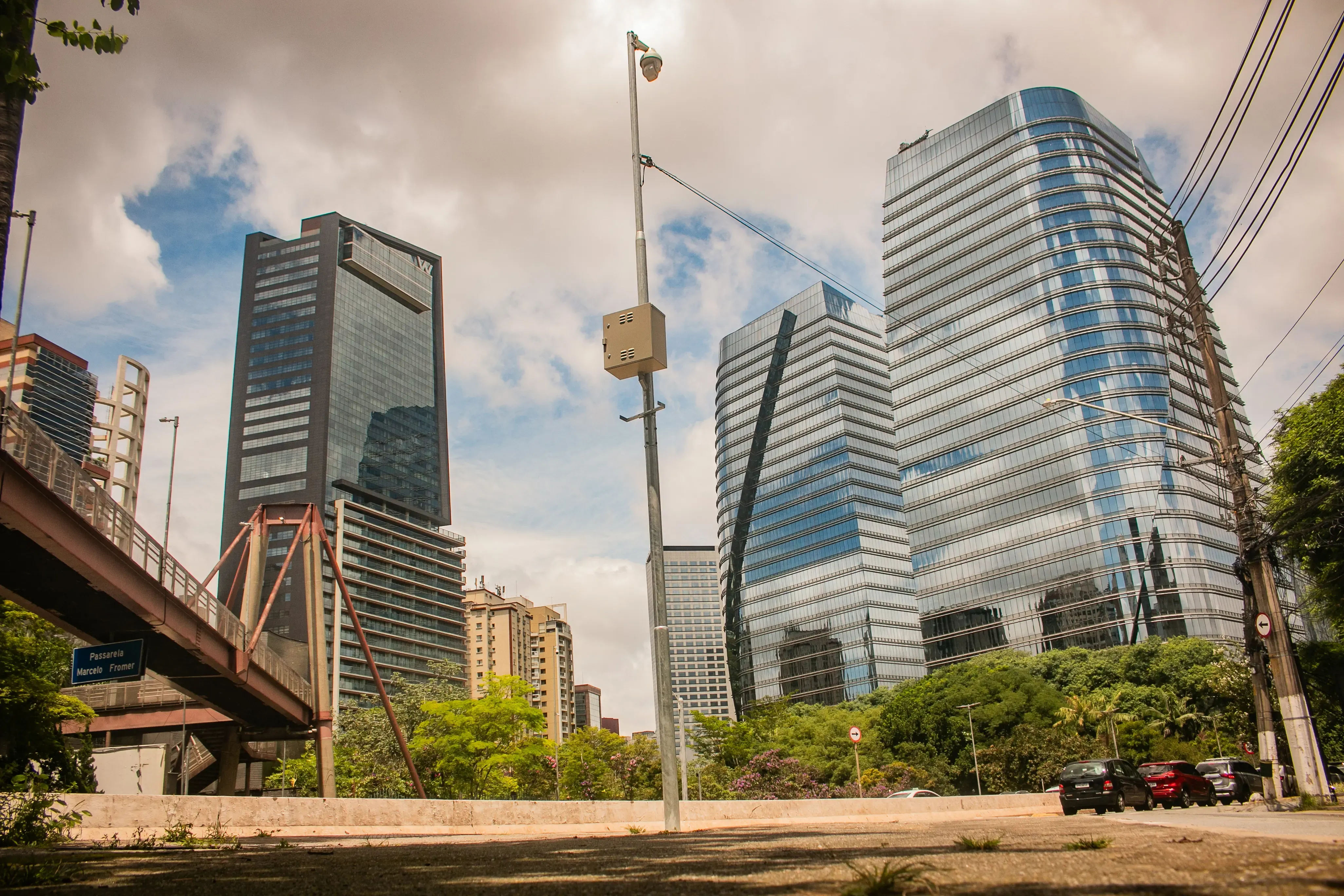 Urban boulevard lined with high-rises and trees